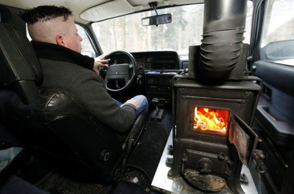 Swiss-Man-Installs-Wood-Burning-Stove-In-volvo-2.jpg